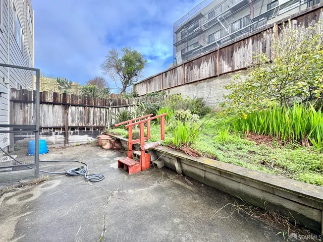 a sitting area with wooden floor