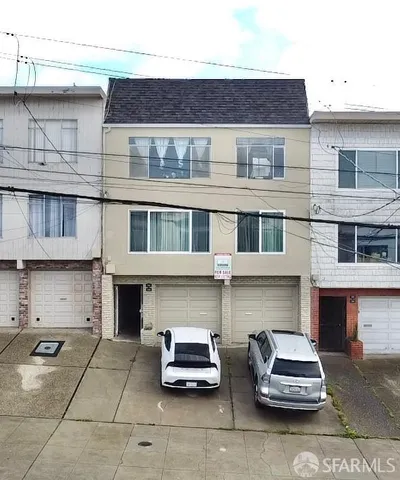 a couple of table and chairs in front of building