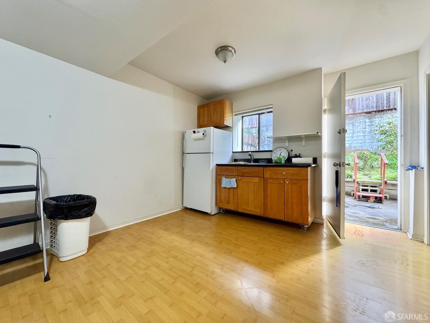 740-742 37th Avenue San Francisco, CA 94121 - Photo 4 of 20 a kitchen with a stove a refrigerator and a view of living room