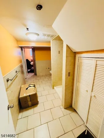 a bathroom with a sink a toilet a mirror a vanity and shower