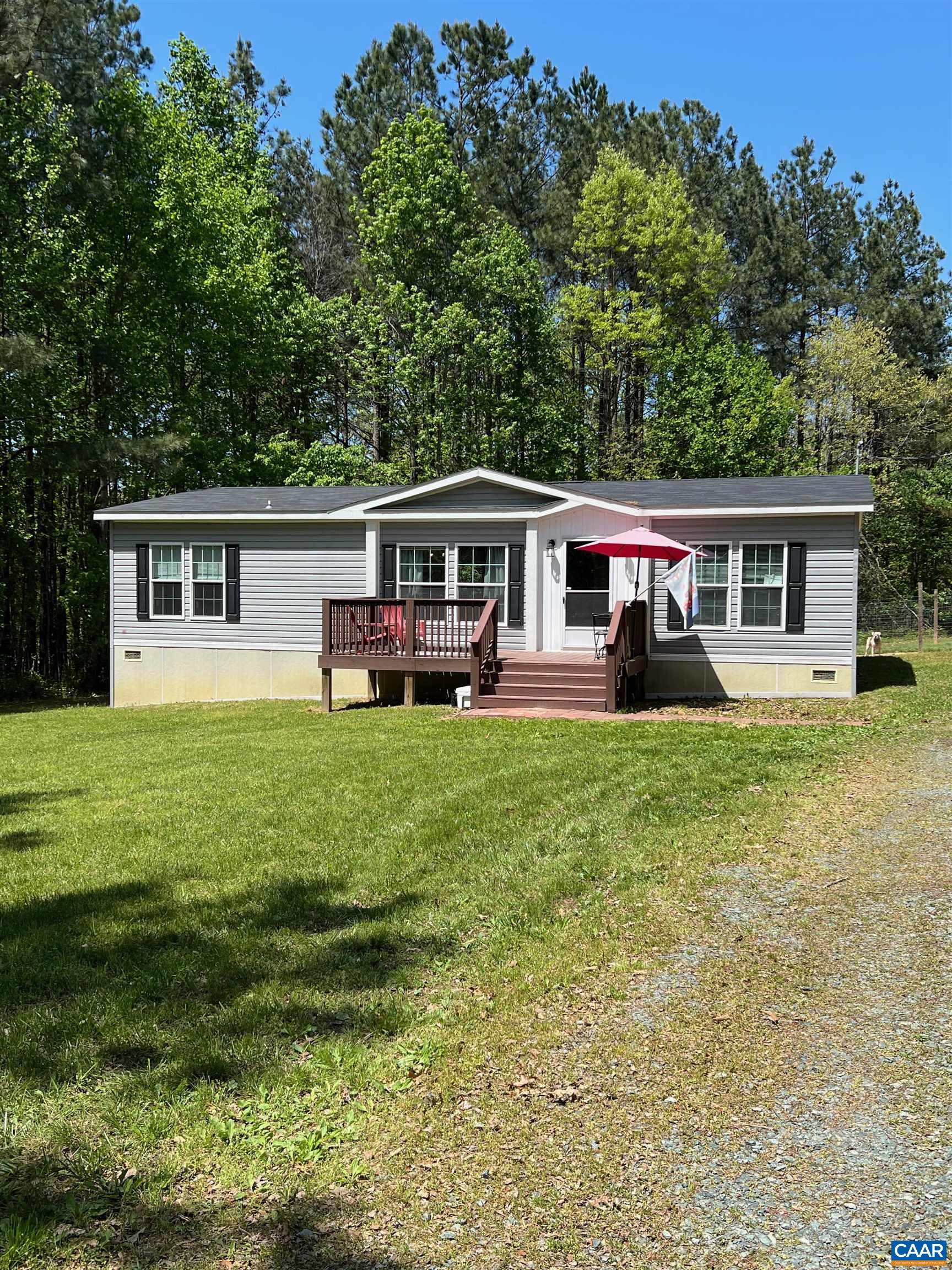 1261 Miles Jackson Road Palmyra, VA 22963 - Photo 1 of 40 a view of a house with a yard deck and a patio