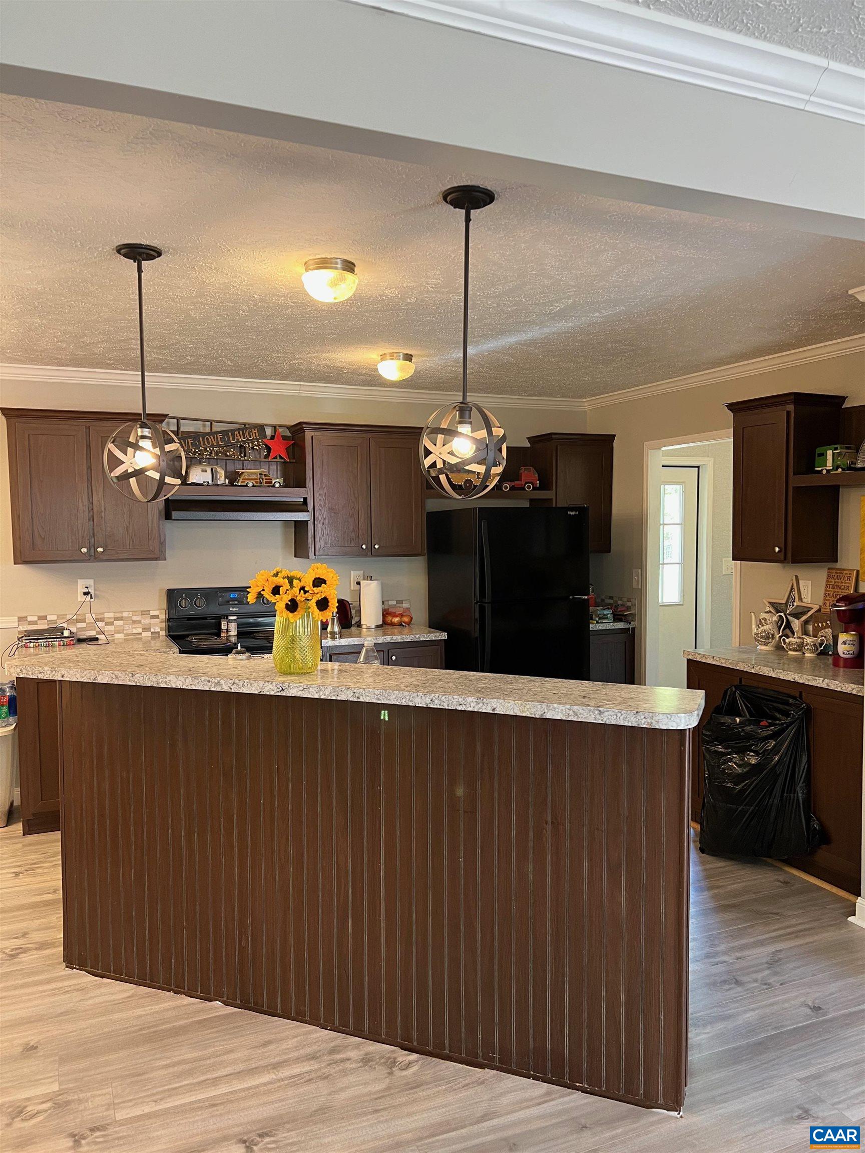 1261 Miles Jackson Road Palmyra, VA 22963 - Photo 11 of 40 a kitchen with a refrigerator and wooden floor