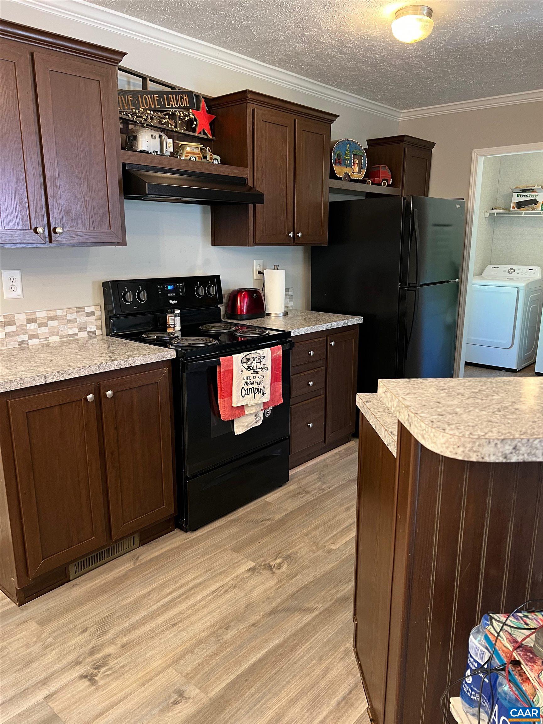1261 Miles Jackson Road Palmyra, VA 22963 - Photo 13 of 40 a kitchen with stainless steel appliances granite countertop a refrigerator stove and a sink