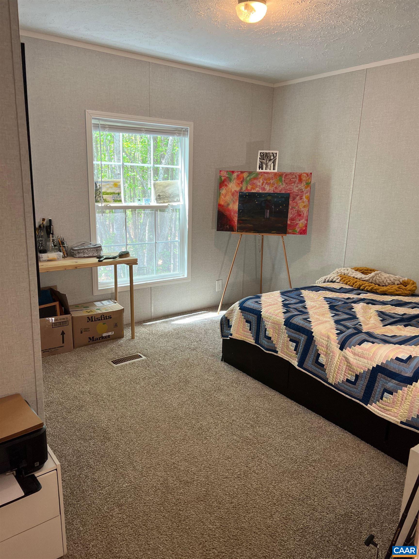 1261 Miles Jackson Road Palmyra, VA 22963 - Photo 17 of 40 a bed room with a bed and a desk