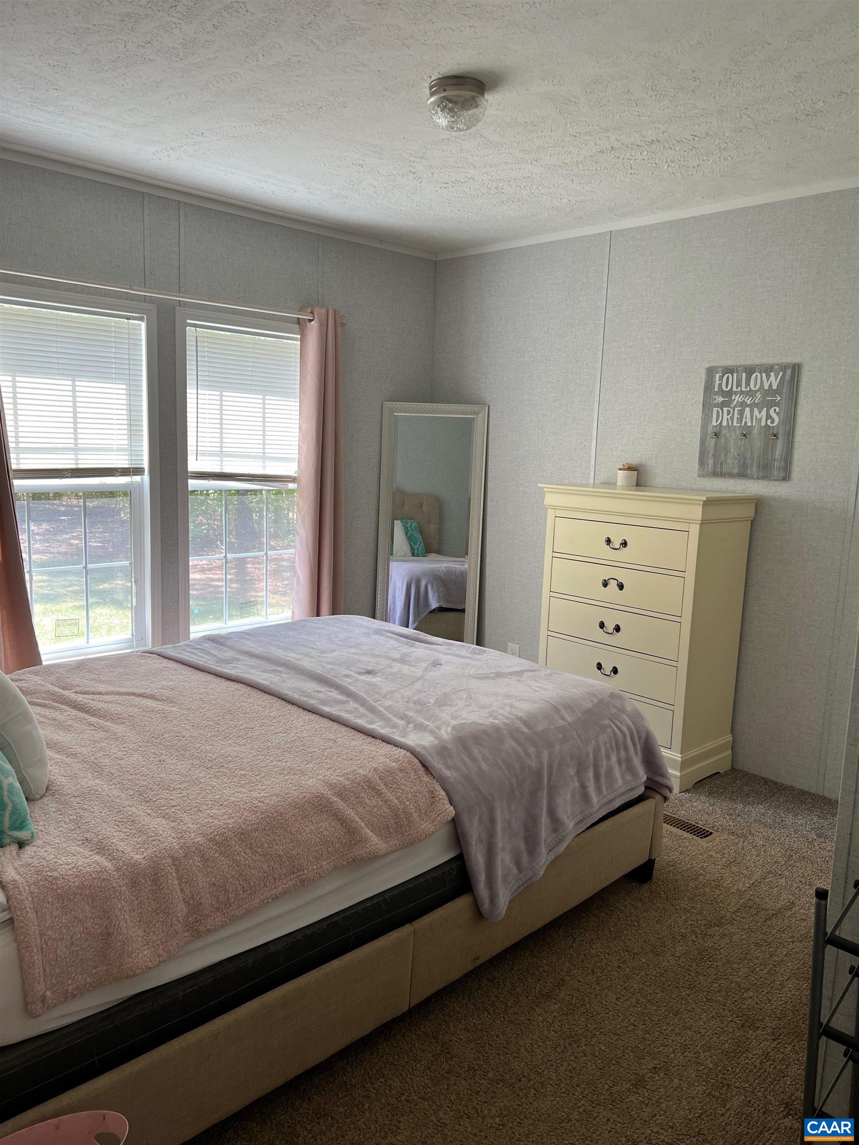 1261 Miles Jackson Road Palmyra, VA 22963 - Photo 19 of 40 a bedroom with a bed and a window