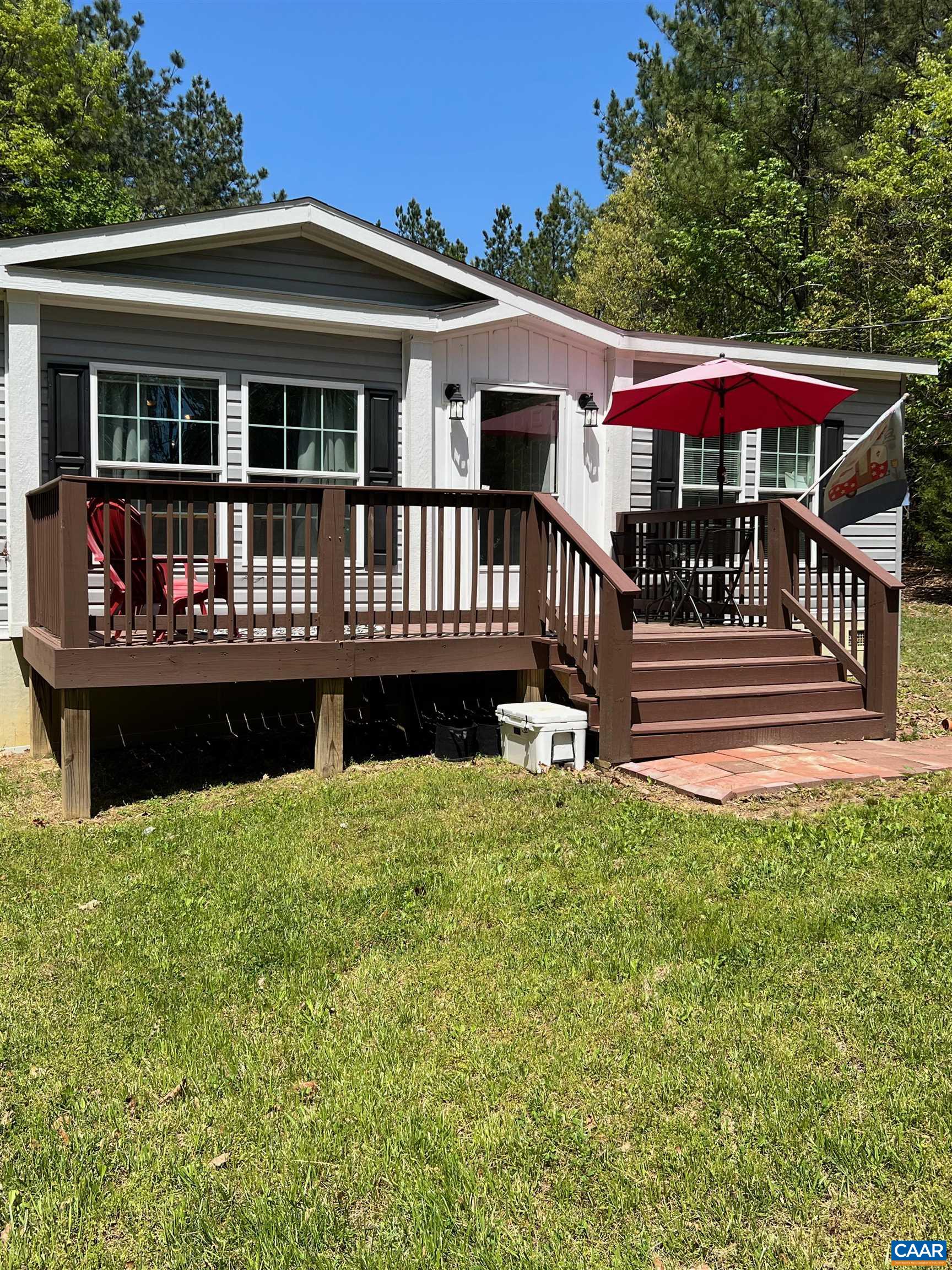 1261 Miles Jackson Road Palmyra, VA 22963 - Photo 2 of 40 a front view of a house with swimming pool and deck
