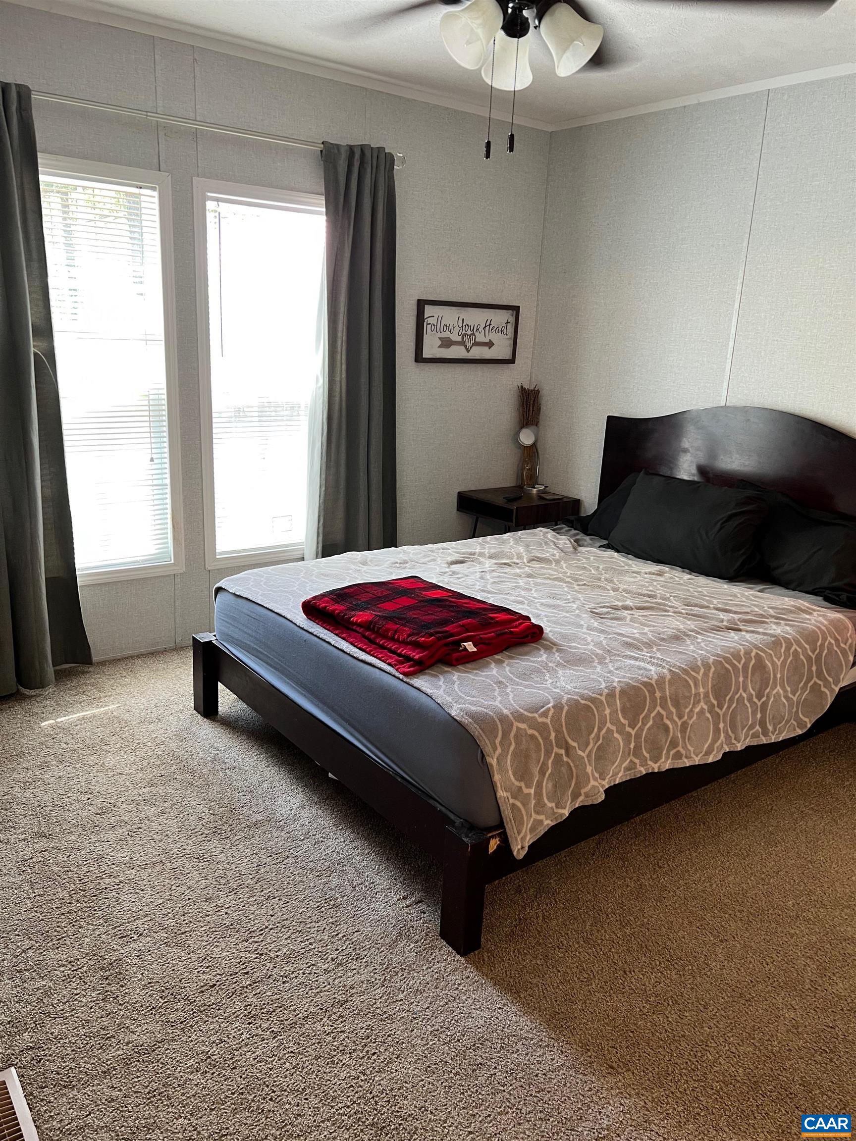 1261 Miles Jackson Road Palmyra, VA 22963 - Photo 22 of 40 a bedroom with a bed and a window
