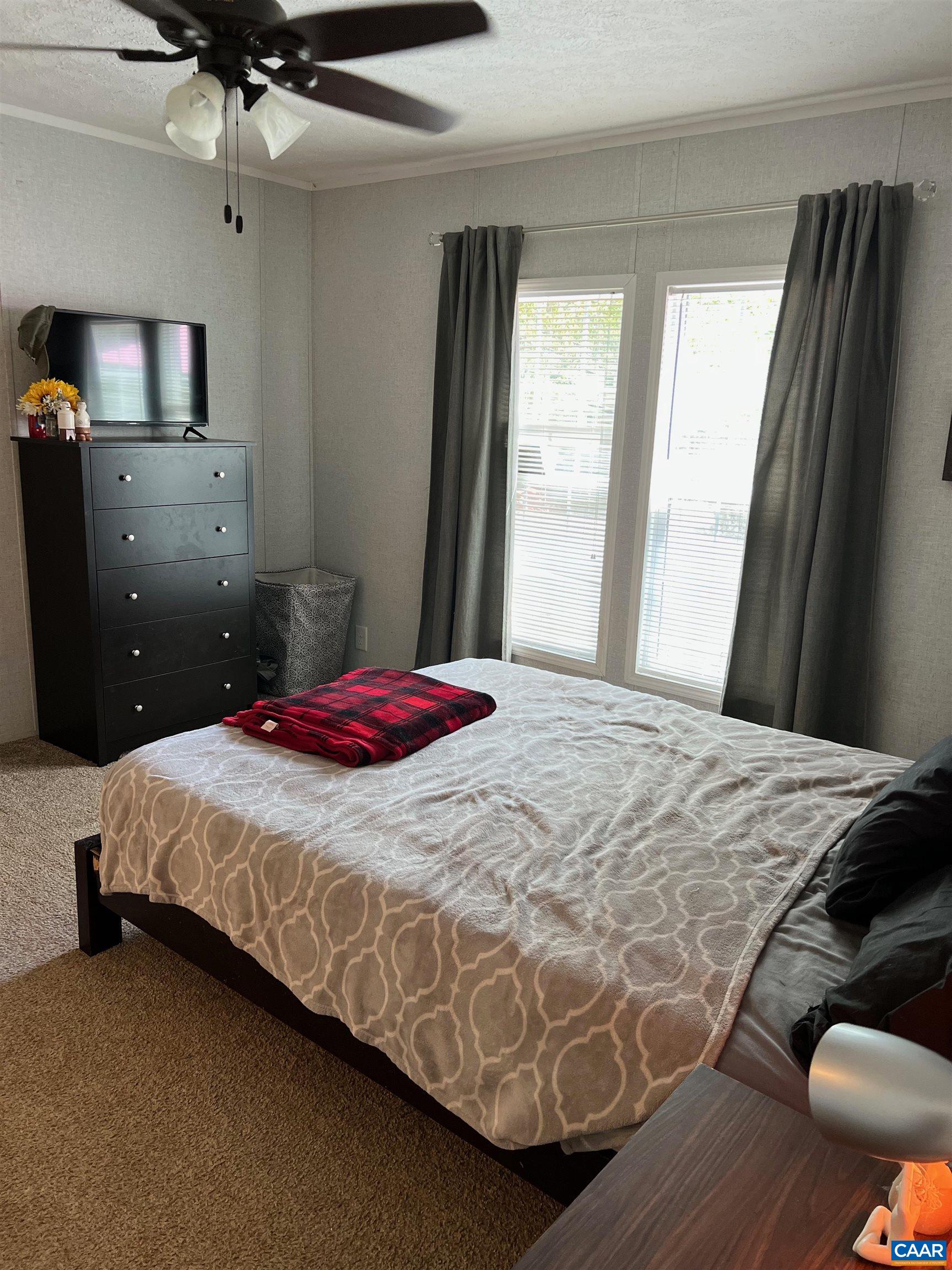 1261 Miles Jackson Road Palmyra, VA 22963 - Photo 23 of 40 a bedroom with a bed and window