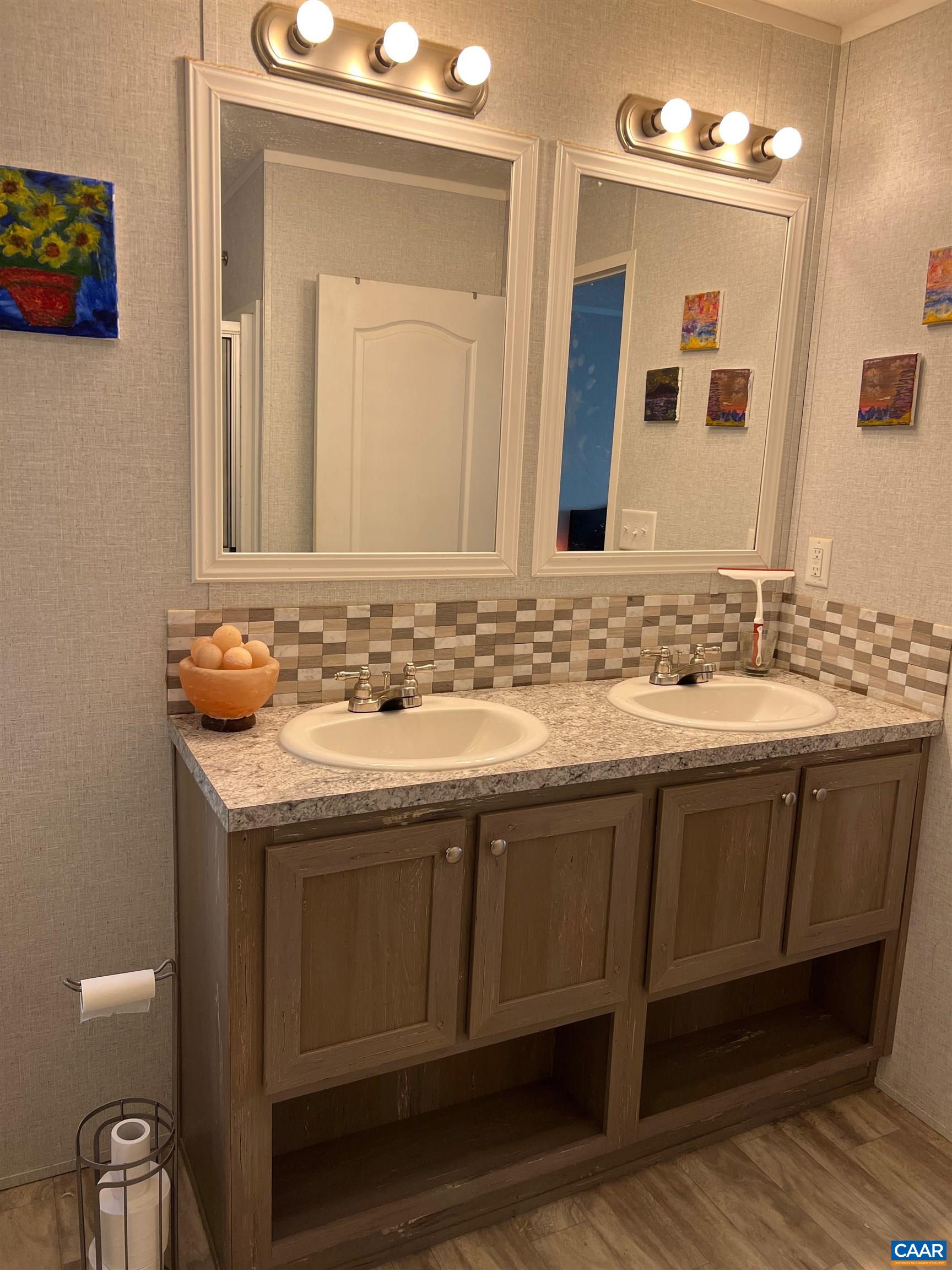 1261 Miles Jackson Road Palmyra, VA 22963 - Photo 26 of 40 a bathroom with a sink and a mirror