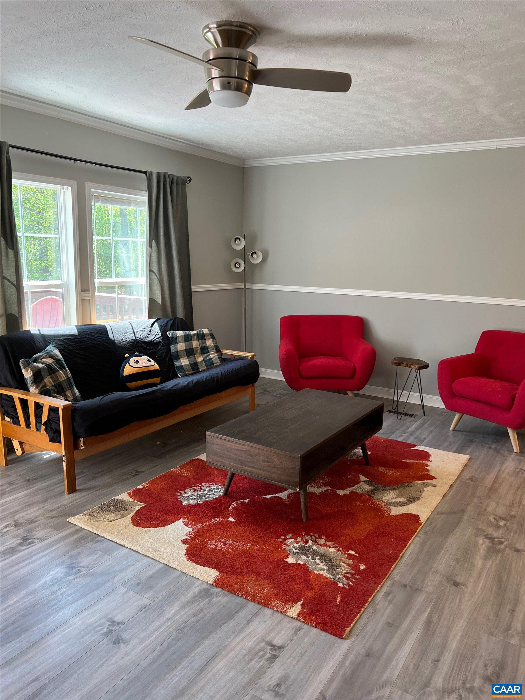 1261 Miles Jackson Road Palmyra, VA 22963 - Photo 9 of 40 a living room with furniture a rug and a window