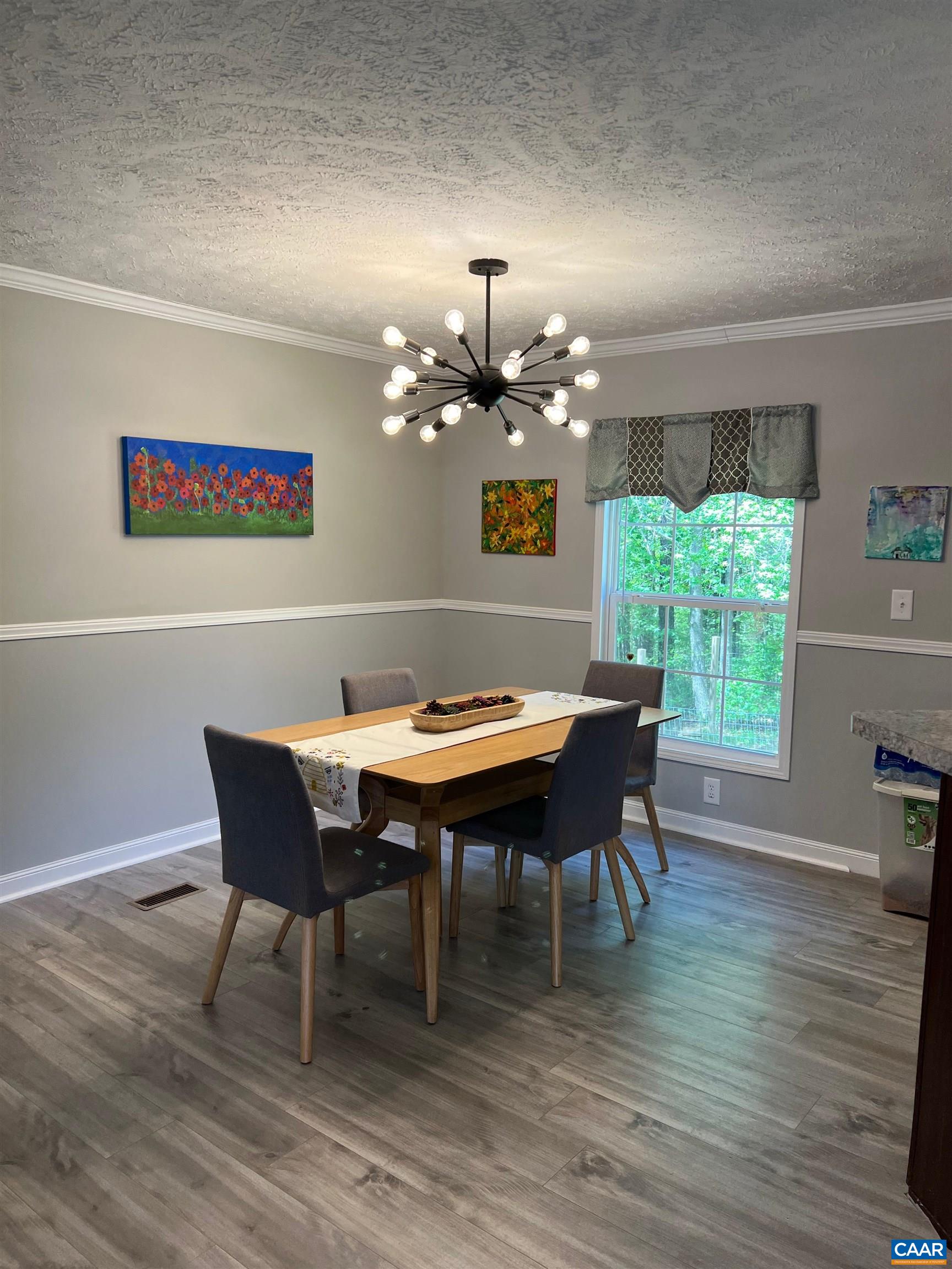 1261 Miles Jackson Road Palmyra, VA 22963 - Photo 10 of 40 a view of a dining room with furniture window and wooden floor