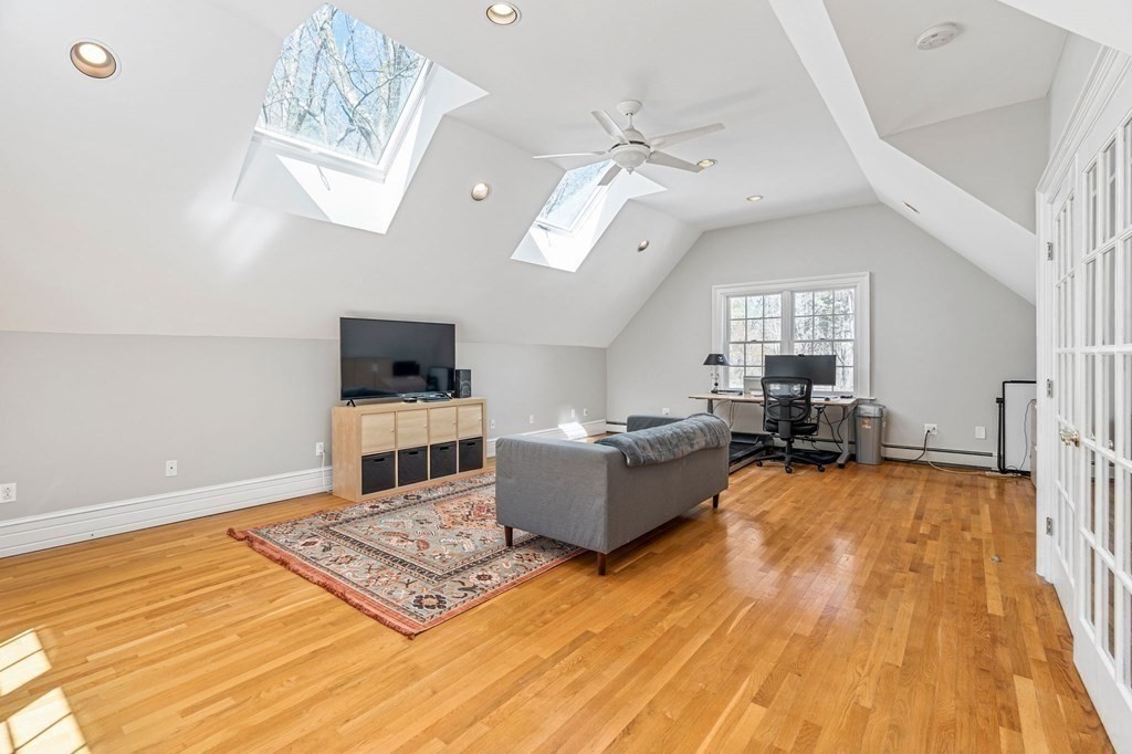 19 Sedgemeadow Road Wayland, MA 01778 - Photo 31 of 40 a living room with furniture and a flat screen tv