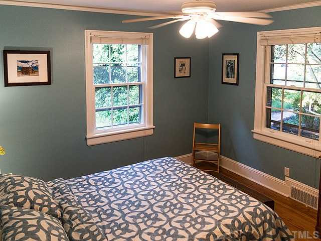 2811 Barmettler Street Raleigh, NC 27607 - Photo 14 of 22 a bedroom with a bed and a window
