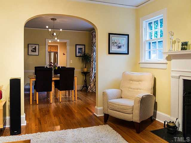 2811 Barmettler Street Raleigh, NC 27607 - Photo 9 of 22 a living room with furniture and a fireplace