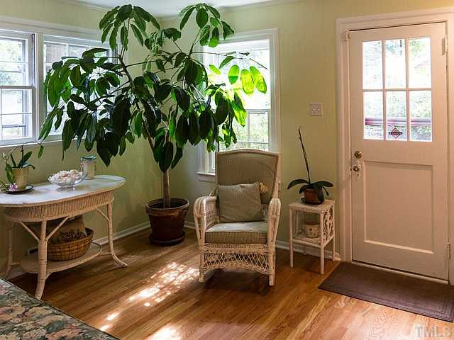2811 Barmettler Street Raleigh, NC 27607 - Photo 10 of 22 a living room filled with furniture and a potted plant