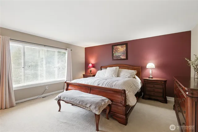 a bedroom with a bed and window