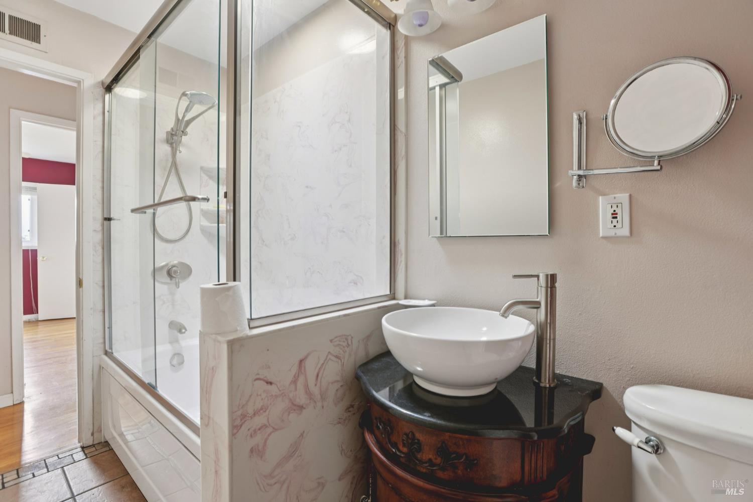 1023 Avondale Lane Hayward, CA 94545 - Photo 11 of 24 a bathroom with a toilet sink and a mirror