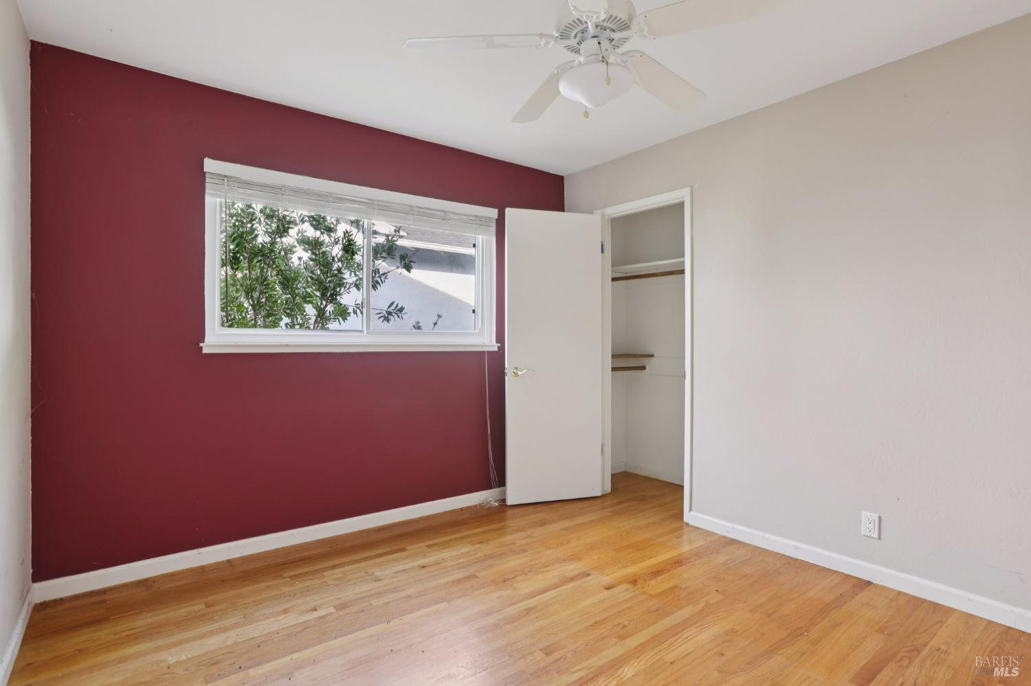 1023 Avondale Lane Hayward, CA 94545 - Photo 12 of 24 an empty room with wooden floor closet and windows