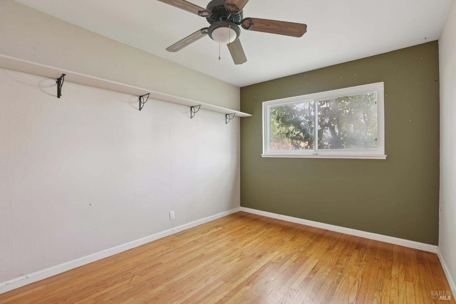 1023 Avondale Lane Hayward, CA 94545 - Photo 14 of 24 a view of empty room with wooden floor