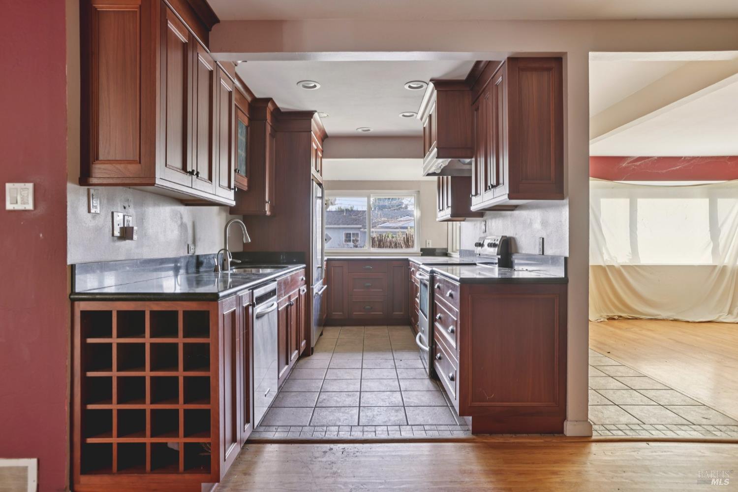 1023 Avondale Lane Hayward, CA 94545 - Photo 7 of 24 a kitchen with stainless steel appliances granite countertop a stove a sink and a refrigerator