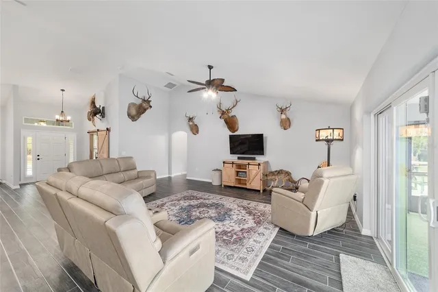 a large kitchen with a table and chairs
