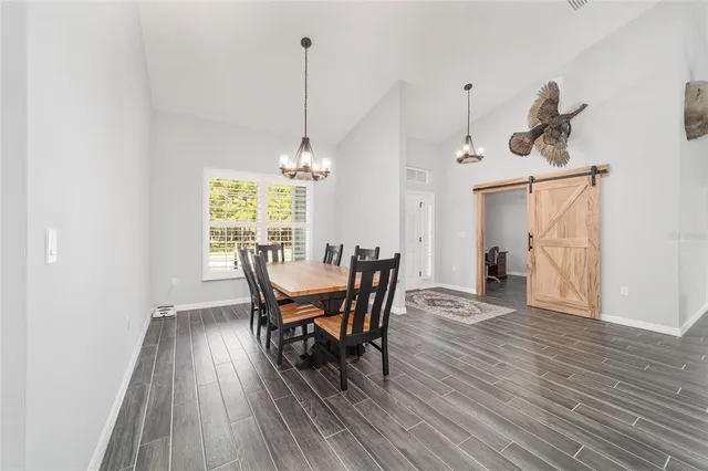 a spacious bathroom with a double vanity sink and a mirror