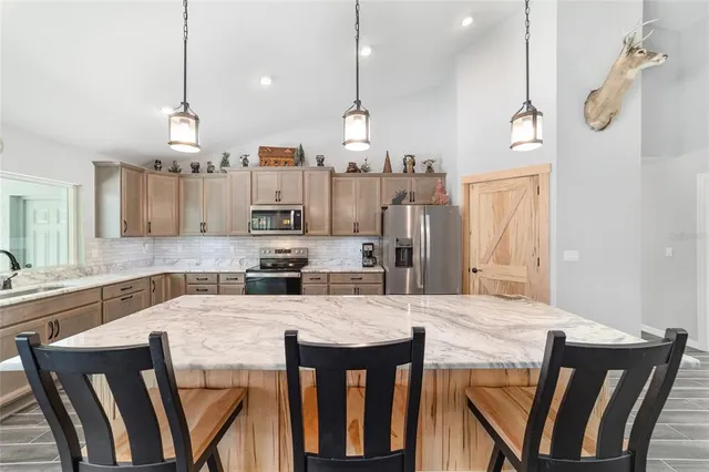 a bathroom with a granite countertop sink toilet a mirror and shower
