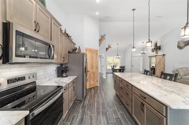 a view of a kitchen and dining room