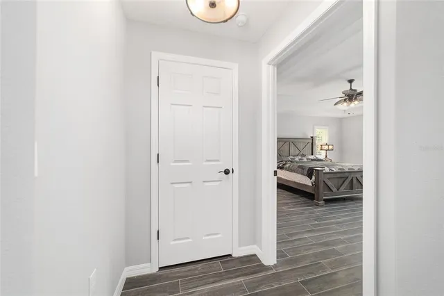 a view of a patio with a table and chairs under an umbrella