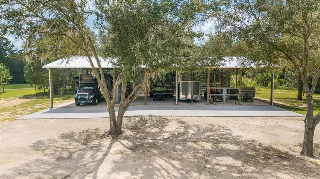 a living room with furniture a flat screen tv and a couch