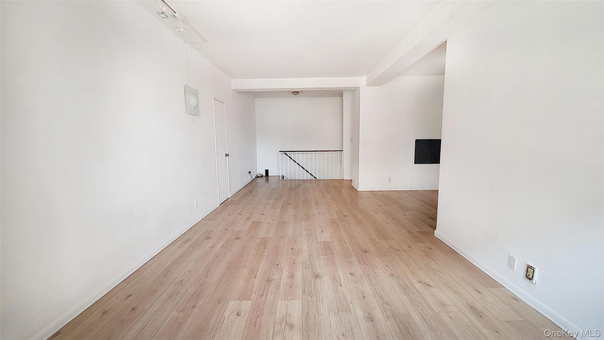 99-52 66th Road, Unit 3T Queens, NY 11374 - Photo 1 of 1 Unfurnished room featuring light wood-style floors and baseboards