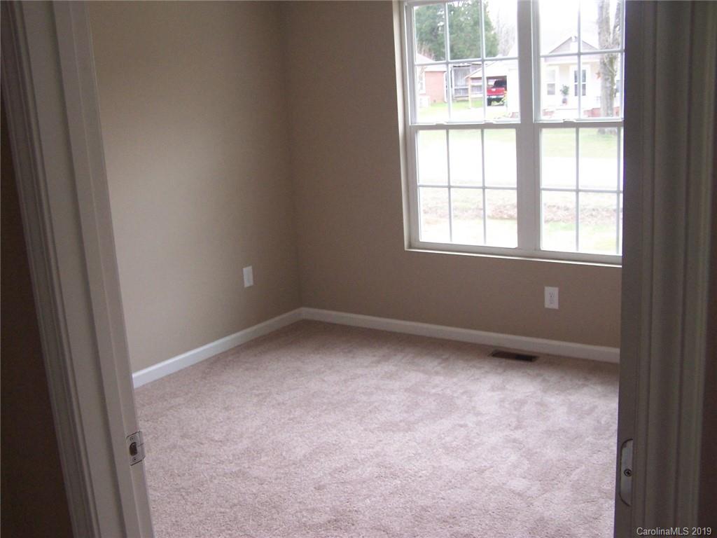 400 Rowan Mill Road Salisbury, NC 28147 - Photo 12 of 24 an empty room with windows