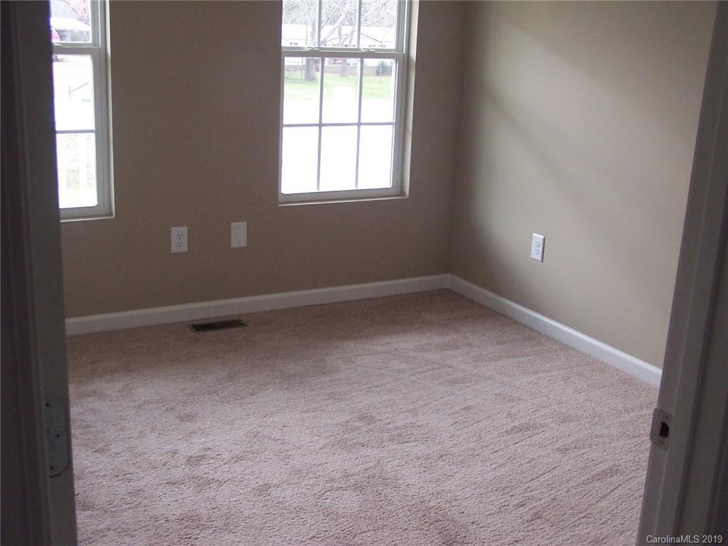 400 Rowan Mill Road Salisbury, NC 28147 - Photo 14 of 24 an empty room with a window