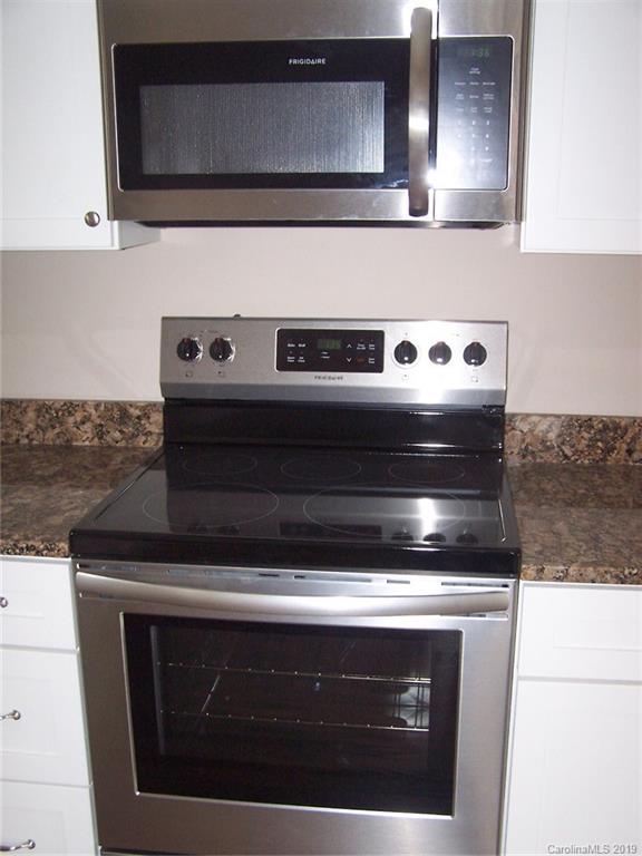 400 Rowan Mill Road Salisbury, NC 28147 - Photo 10 of 24 a stove top oven sitting inside of a kitchen