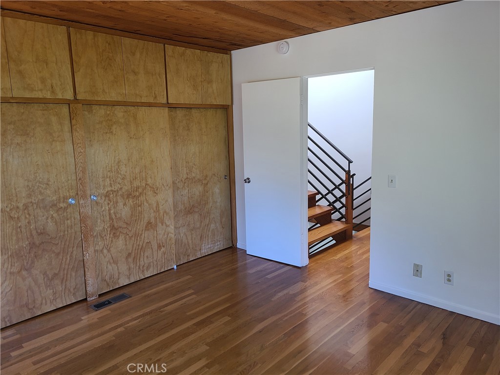 243 Amy Way Topanga, CA 90290 - Photo 18 of 31 a view of an empty room with wooden floor