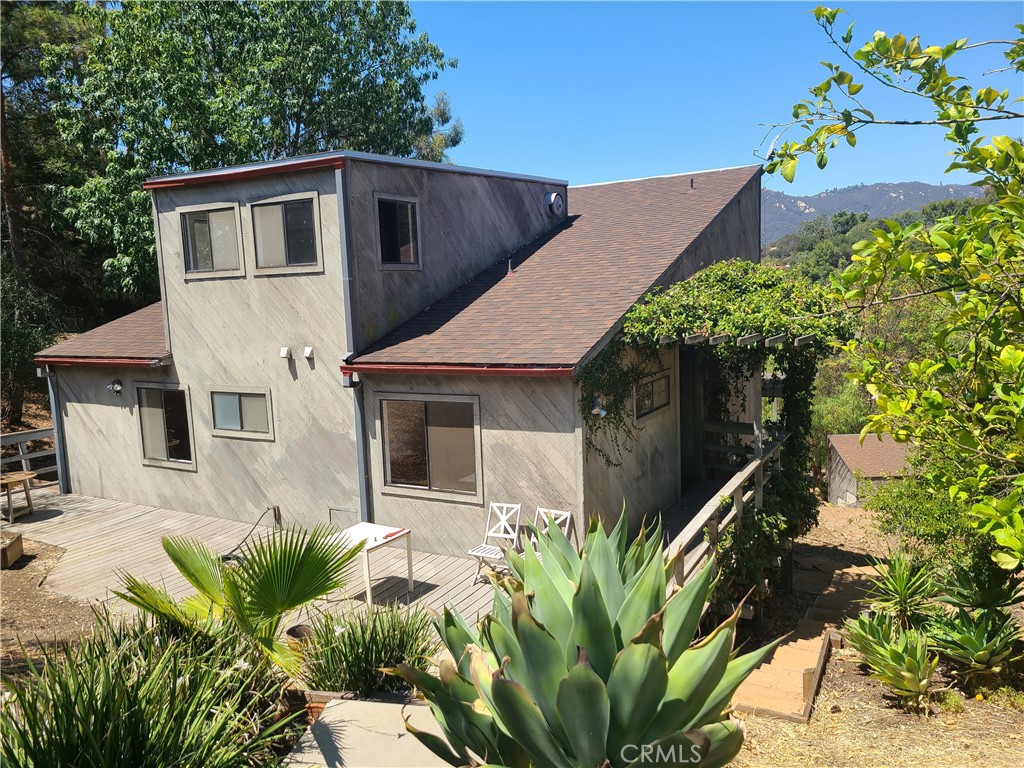 243 Amy Way Topanga, CA 90290 - Photo 22 of 31 a front view of a house with a yard