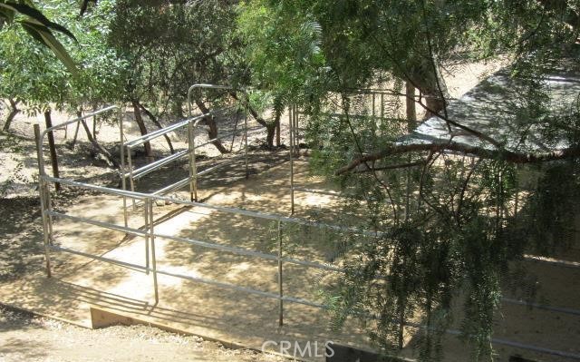 243 Amy Way Topanga, CA 90290 - Photo 25 of 31 a backyard of a house with table and chairs