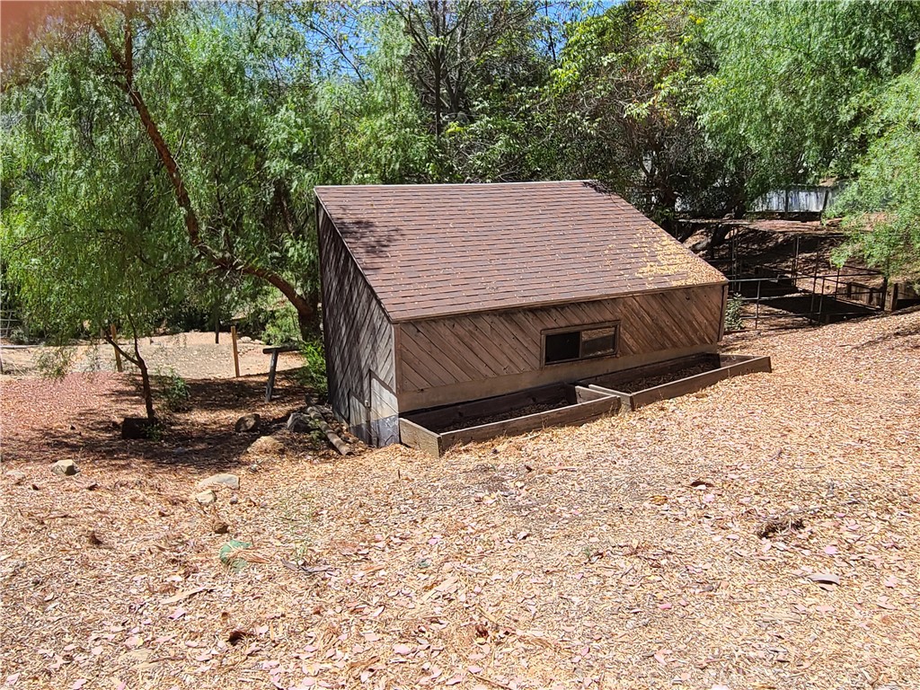 243 Amy Way Topanga, CA 90290 - Photo 26 of 31 a view of a backyard with a large tree