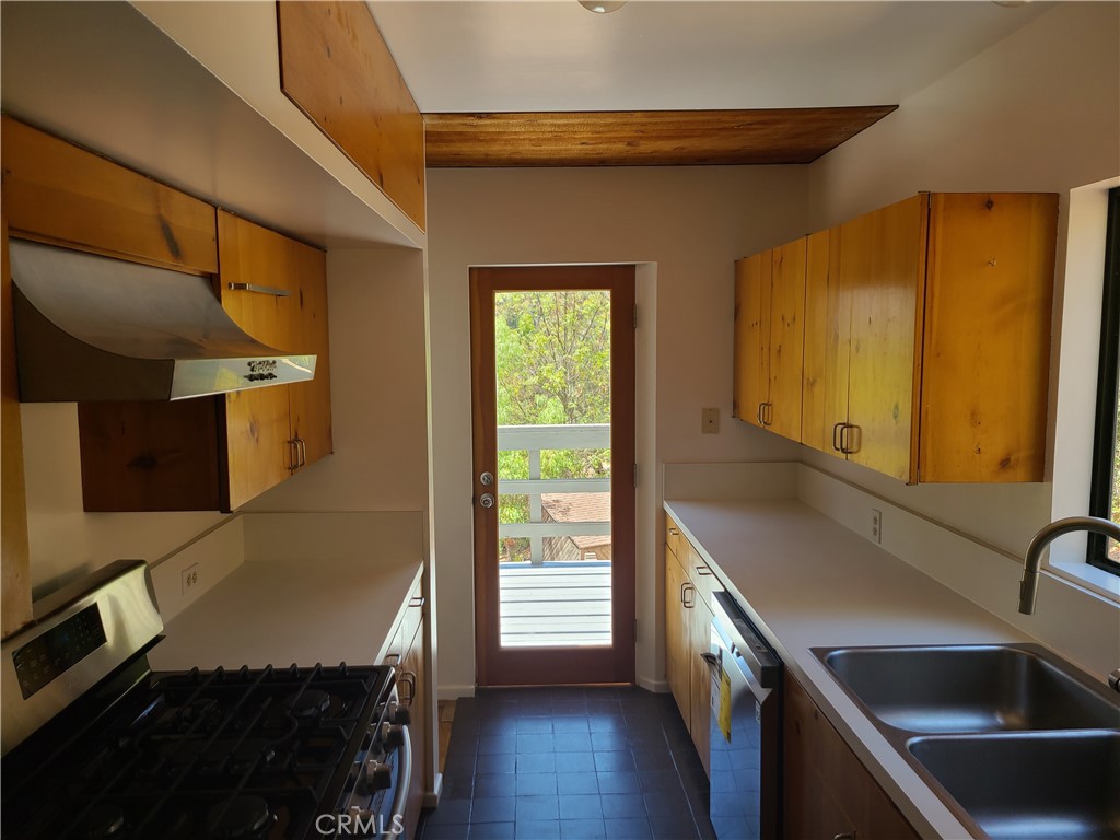 243 Amy Way Topanga, CA 90290 - Photo 4 of 31 a kitchen with a sink and wooden floor