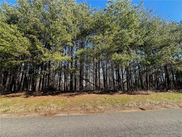 a view of tree in front of a house