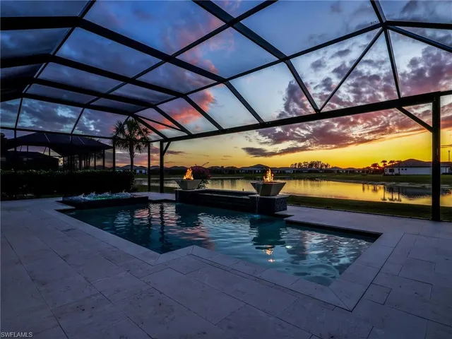 a view of swimming pool with a patio