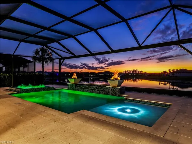 a view of a backyard with sitting area