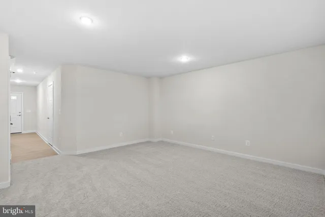 a view of a workspace with furniture and a potted plant
