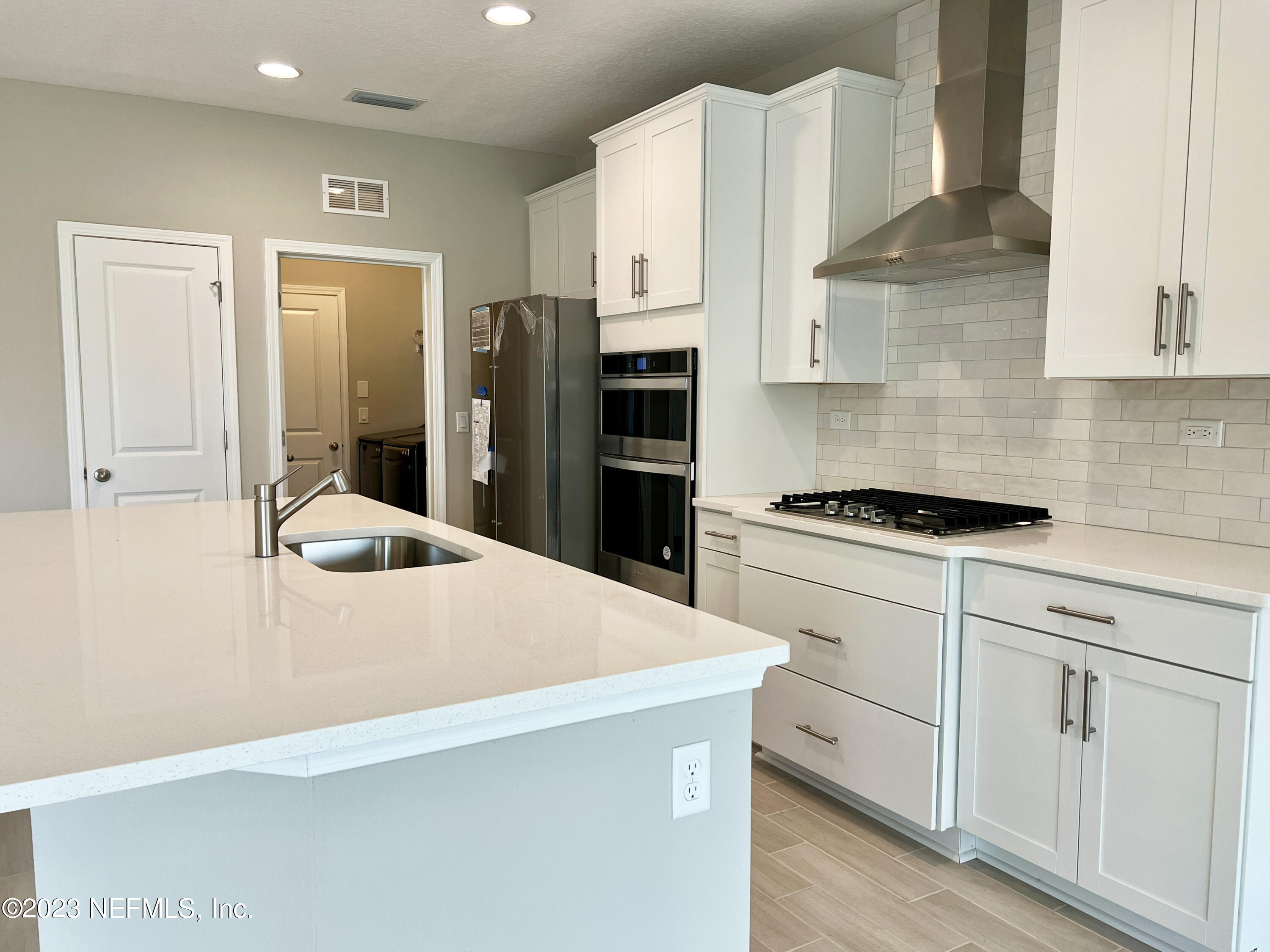 385 Brookgreen Way St. Augustine, FL 32092 - Photo 11 of 32 a kitchen with cabinets and a stainless steel appliances
