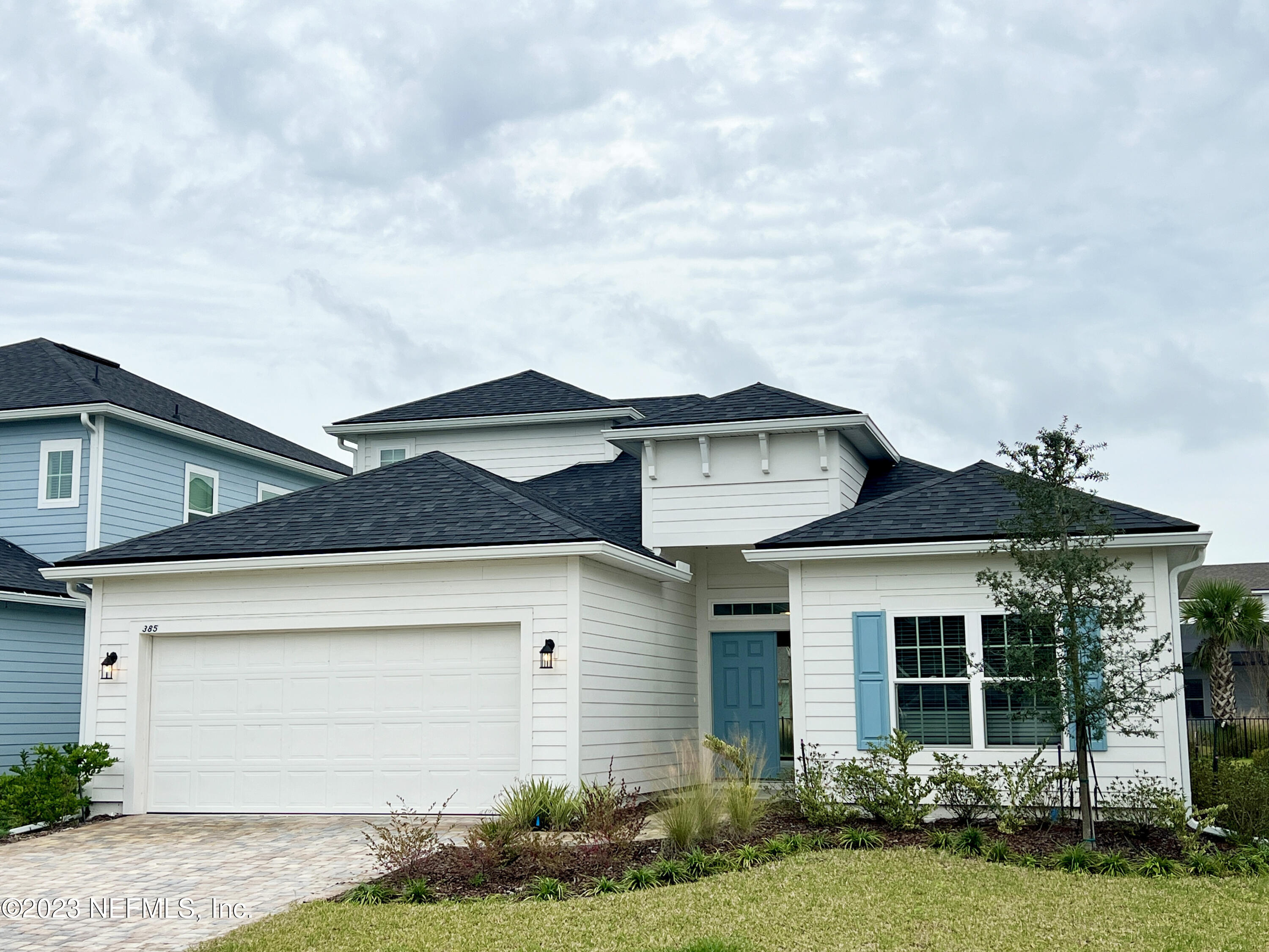 385 Brookgreen Way St. Augustine, FL 32092 - Photo 2 of 32 a front view of a house with a garden and yard