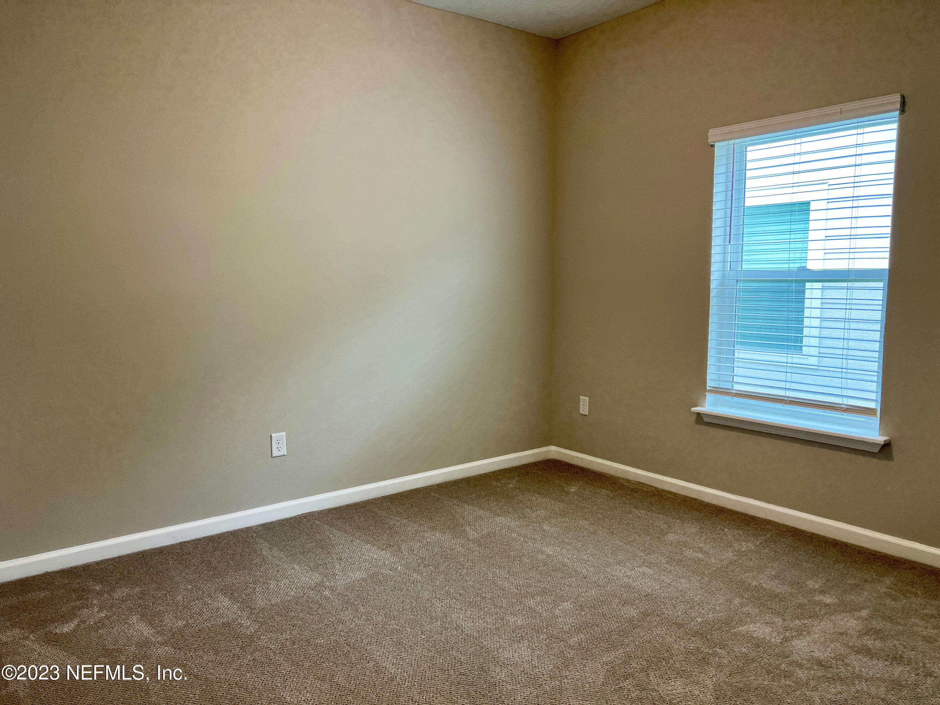 385 Brookgreen Way St. Augustine, FL 32092 - Photo 22 of 32 an empty room with a window