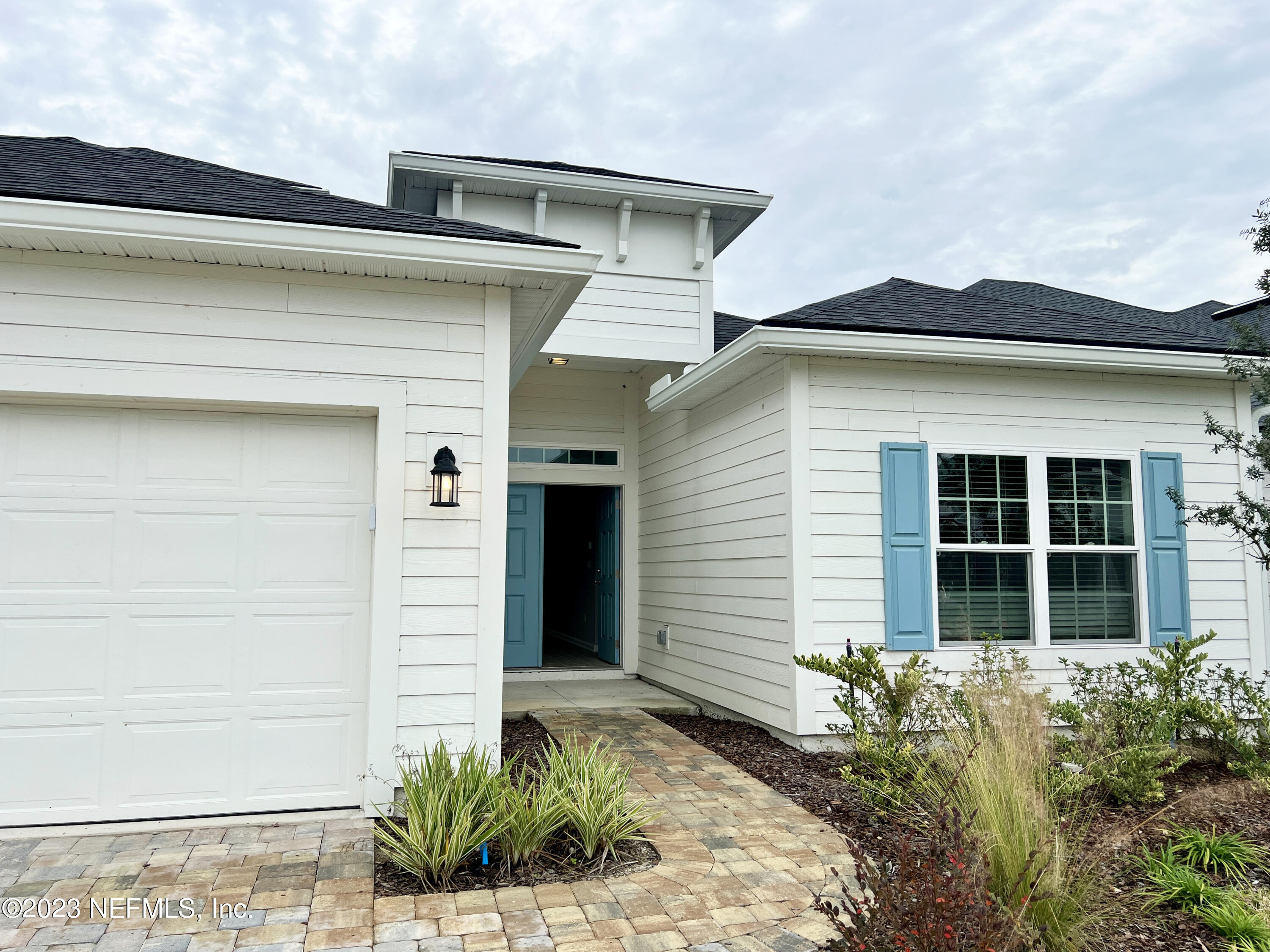 385 Brookgreen Way St. Augustine, FL 32092 - Photo 3 of 32 a front view of a house with plants