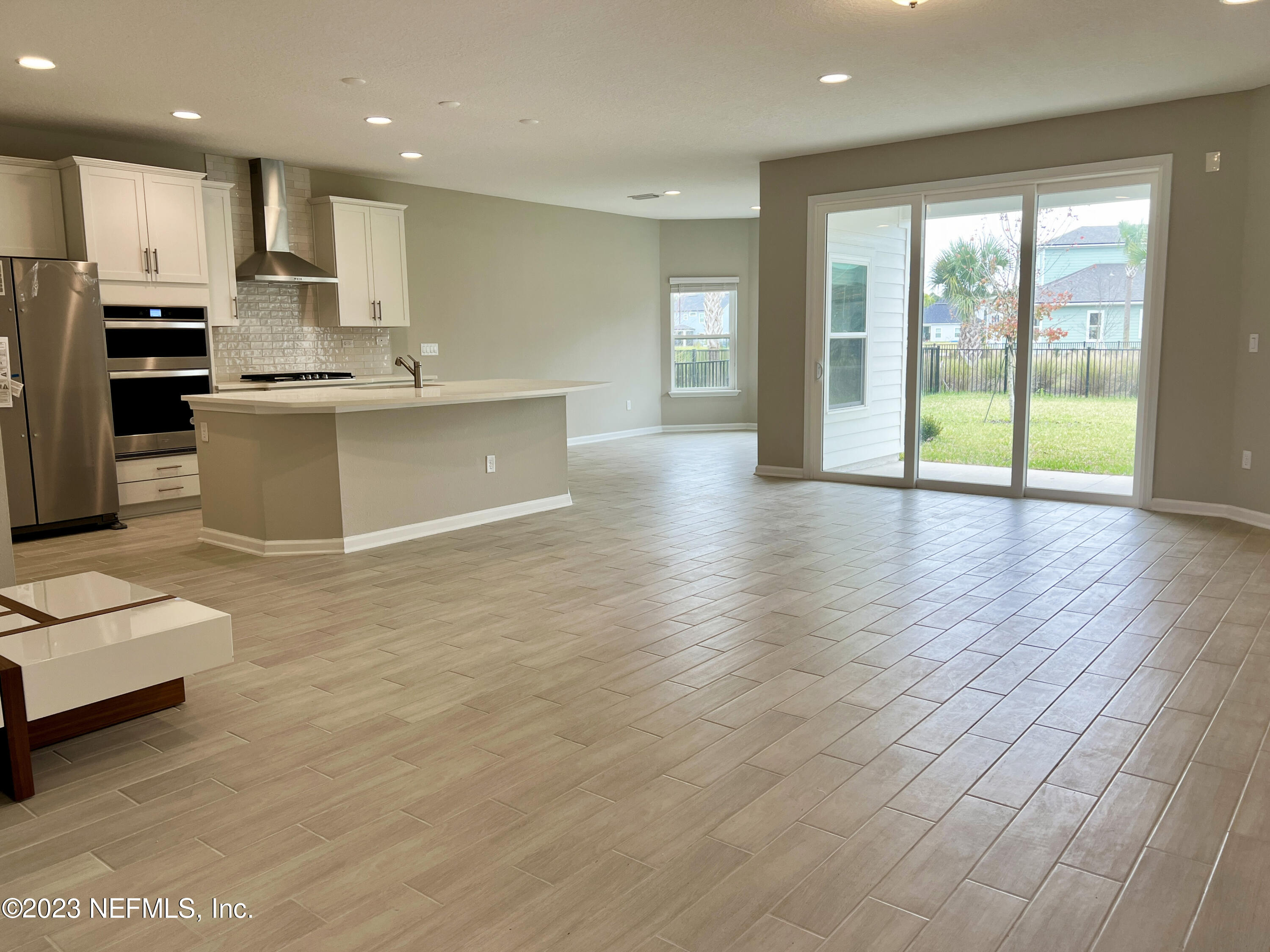 385 Brookgreen Way St. Augustine, FL 32092 - Photo 5 of 32 a large kitchen with stainless steel appliances granite countertop a large counter top a stove and a sink