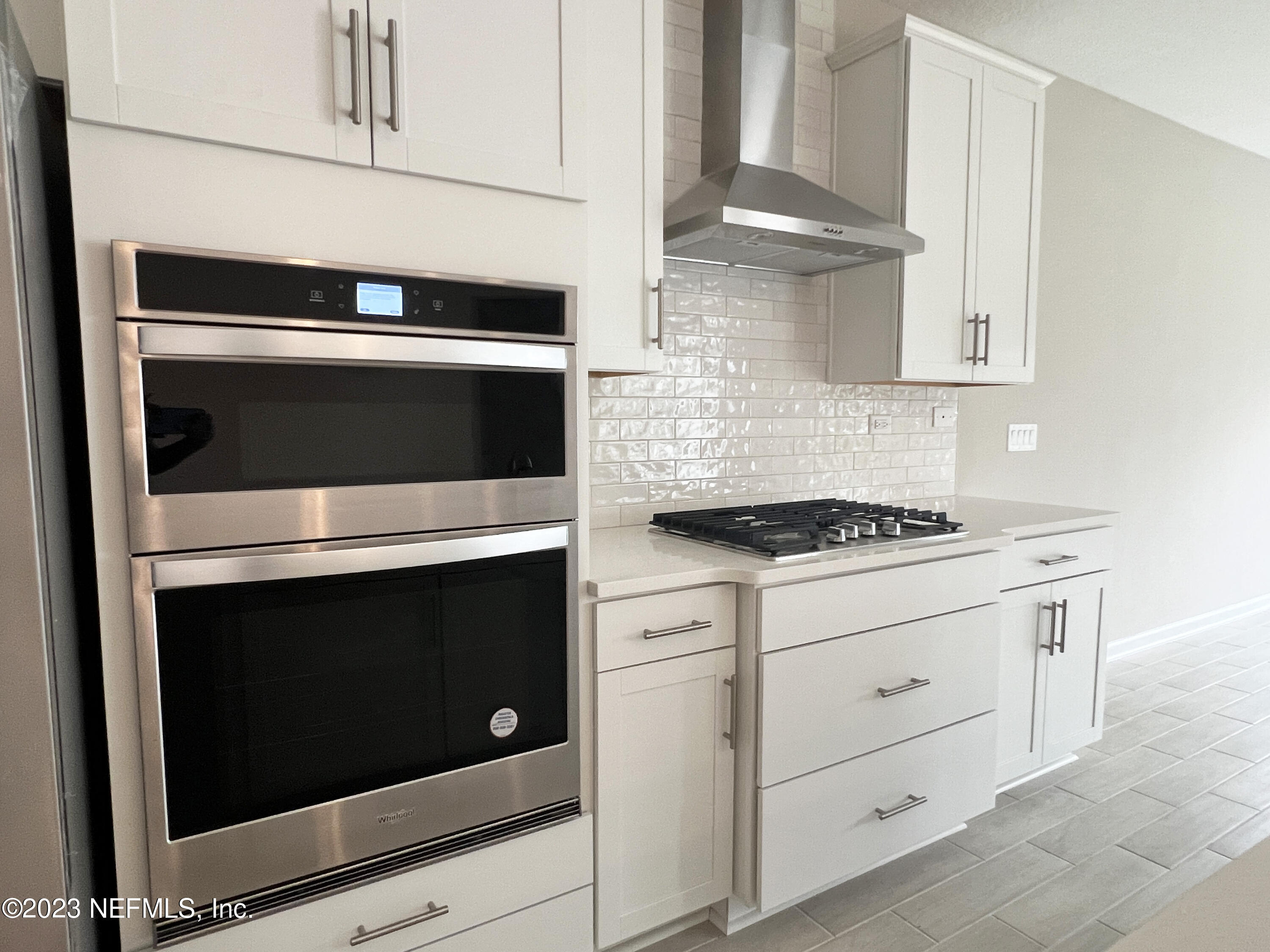 385 Brookgreen Way St. Augustine, FL 32092 - Photo 9 of 32 a kitchen with granite countertop cabinets stainless steel appliances and wooden cabinets