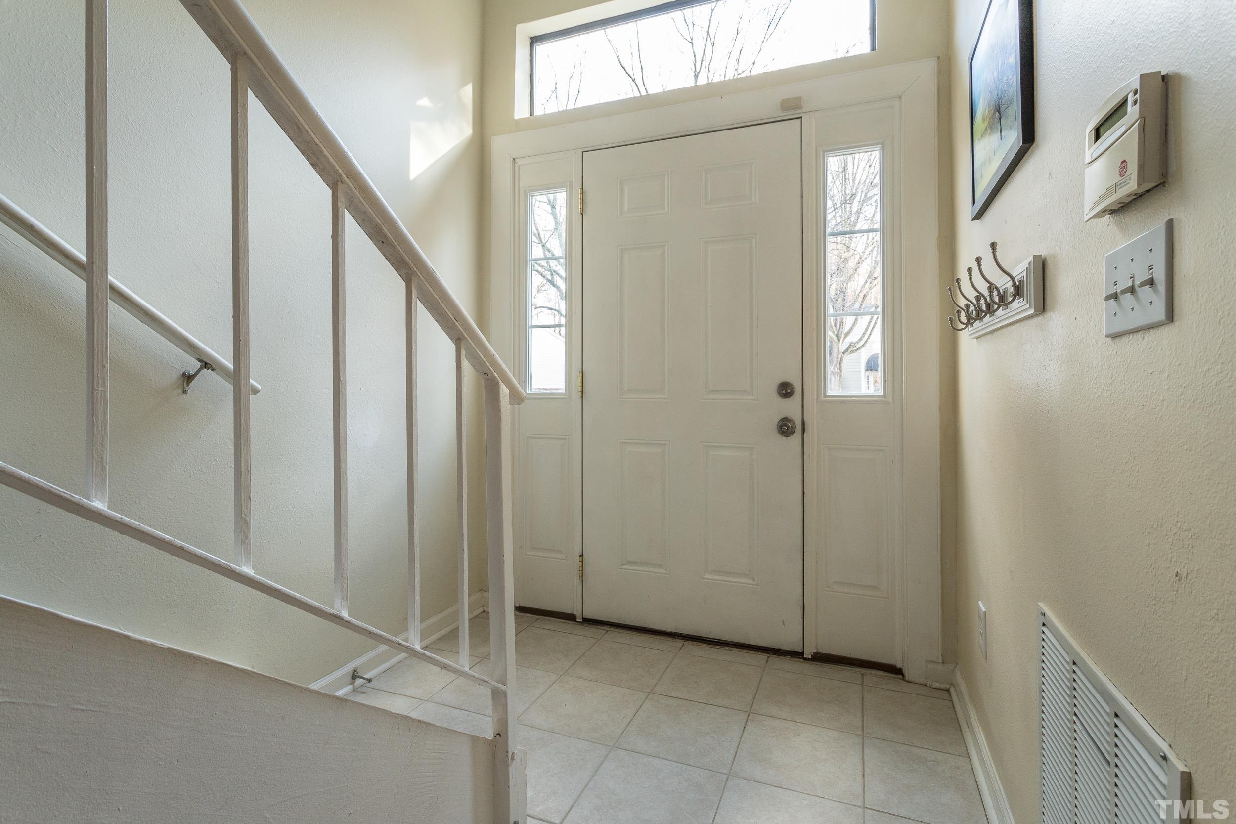 7808 Falcon Rest Circle Raleigh, NC 27615 - Photo 22 of 28 a view of an entryway with staircase